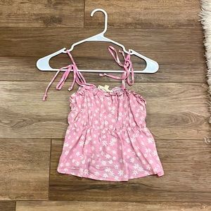 Woman’s pink floral top
